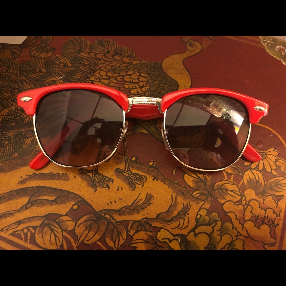 Red wayfarer sunglasses.